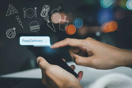 Hand people using smartphones ordering food online food delivery apps  with food icon at home....