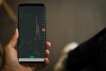 hand of businessmen looking at stock tickers or graphs cryptocurrency trading platforms on...