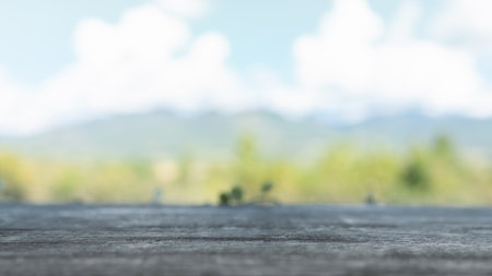 Empty, no people. Focus soft spot on the wooden table. Abstract natural cloud blue sky and mountain...