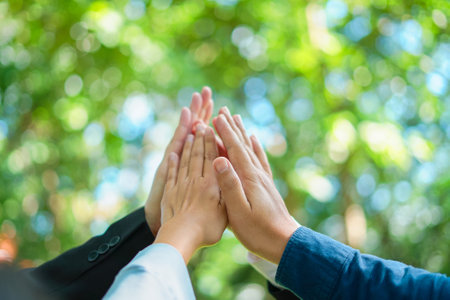 partnership join for CSR and ESG cooperation Global community teamwork, environmental energy-saving cooperation for the Sustainable Development Goals, Strong hand group business cooperation success.の写真素材