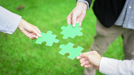 Business hand-holding jigsaw puzzle With the cooperation of business people team joins together to campaign Environment, Society and Corporate Governance. Sustainable corporate social, environmentalの写真素材