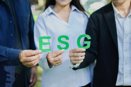 Young professionals and business leaders collaborate on an ESG campaign, driving green initiatives and innovative ideas for a sustainable future in dynamic and busy office environmentの写真素材