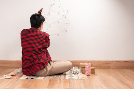 Easy Christmas Tree Light Decoration People are lighting up the wall to celebrate Christmas Day. Copy space for your textの写真素材