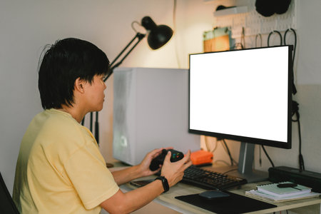 Woman using online game controller with Mockup monitor entertainment concept, fun technology games at homeの写真素材