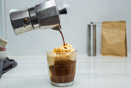 Affogato homemade of Italian Moka coffee pot, affogato is dessert with coffee as base ingredient and...