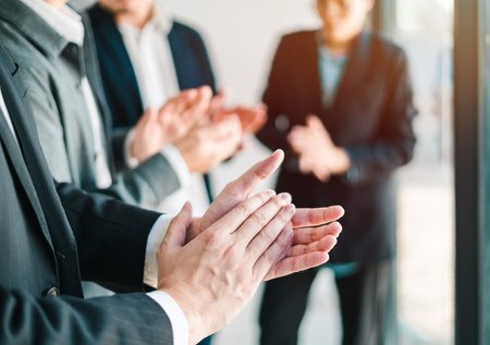 group of businessmen applaud in unity after successful team strategy meeting cooperation harmony and...