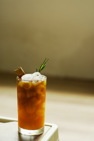 Refreshing iced espresso and orange juice, topped with cinnamon and rosemary Colors and tones...