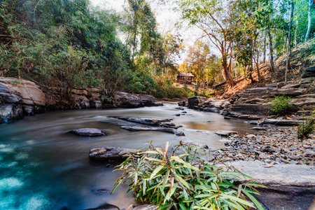 rafting spot on the Mae Wang River in Chiang Mai Province. The river flows, surrounded by rocks and mountains, captured beautifully with  wide-angle lens. tourist attraction in Chiang Mai, Thailand.の写真素材