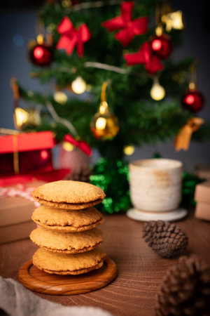 Handmade cookies wrapped with festive rope, capturing the spirit of Christmas and New Year  perfect as heartfelt gift in cozy vertical holiday photo concept.の写真素材