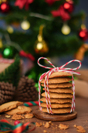 Handmade cookies wrapped with festive rope, capturing the spirit of Christmas and New Year  perfect as heartfelt gift in cozy vertical holiday photo concept.の写真素材