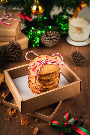 Handmade cookies wrapped with festive rope, capturing the spirit of Christmas and New Year  perfect as heartfelt gift in cozy vertical holiday photo concept.の写真素材