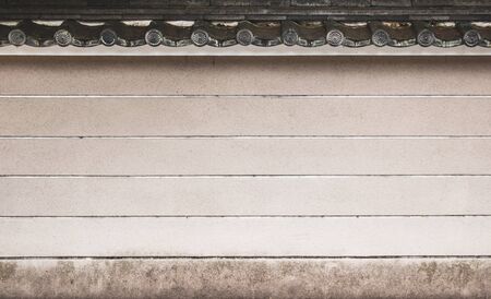 A white brick wall of a Asian historical palaceの写真素材