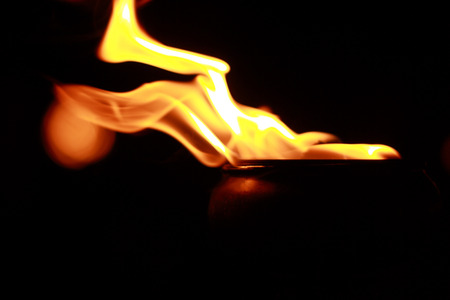 Fire flames on the pots is located in the darkの写真素材