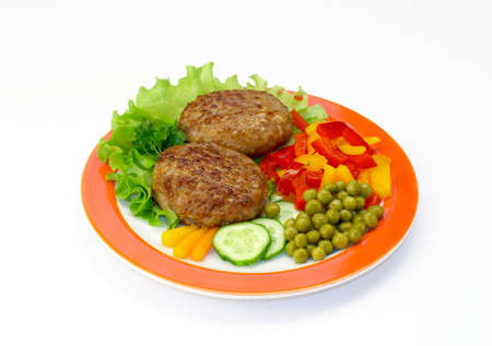 Cutlets in a plate with vegetables