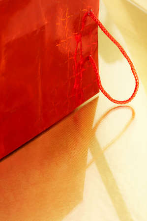 The red package on a gold backgroundの写真素材