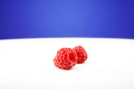 The fresh raspberry lays on a white backgroundの写真素材