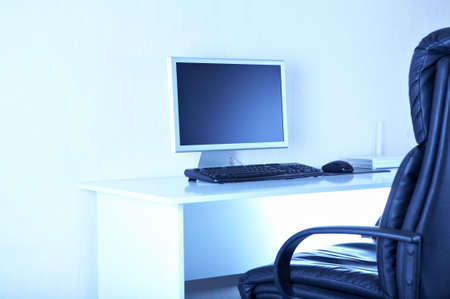 Workplaces with computer in blue tonesの写真素材