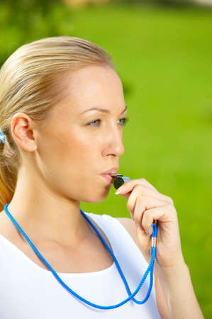 The attractive blonde - judge with a whistleの写真素材