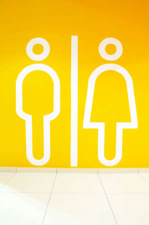 Symbol of the man and the woman on an orange backgroundの写真素材