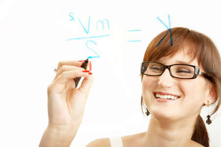 The laughing student writes the formula on a boardの写真素材