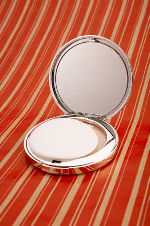 Collapsible mirror on a bright backgroundの写真素材