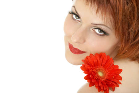 Portrait of the beautiful woman with red gerbera, isolatedの写真素材