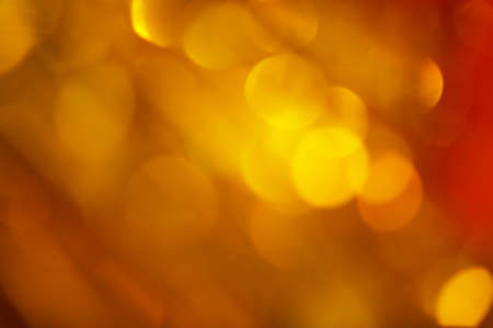 Gold-reddish background with blinking and flashesの写真素材
