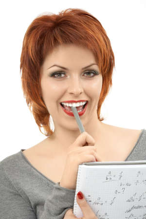 The friendly girl laughs, solving the mathematical problem, isolatedの写真素材