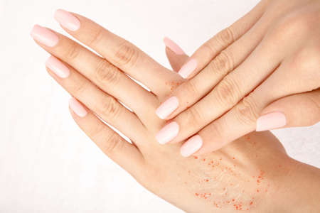 Hands put cosmetic means one on another, isolatedの写真素材