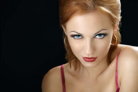 Beautiful girl on a black background, isolatedの写真素材
