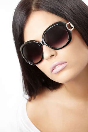 Portrait of the sensual girl in sun glasses, isolatedの写真素材