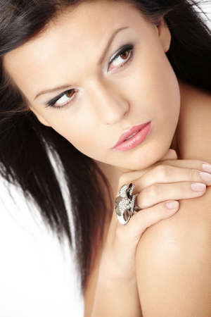 Portrait of beauty with a precious ring and flying hair, isolatedの写真素材