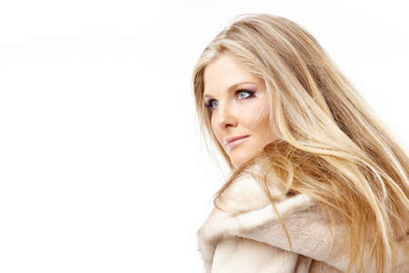 Portrait of the charming blonde in the fur collar, isolatedの写真素材