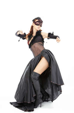 Dancing woman in a mask and the black dress, isolatedの写真素材