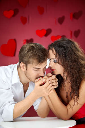 Enamoured man kisses hands of the beautiful woman
の写真素材