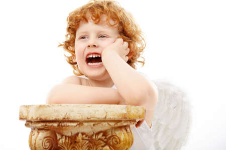 Angered small cupid on a white backgroundの写真素材