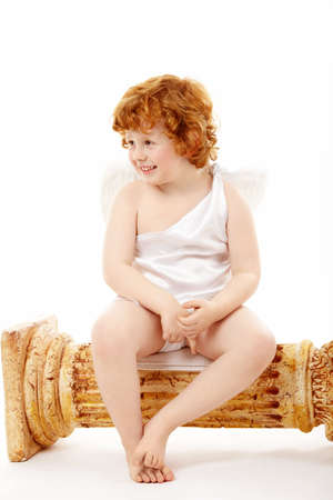 Carefree small cupid isolated on a white backgroundの写真素材
