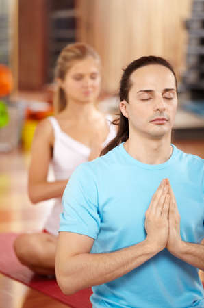 Pose of a lotus performed by pair in sport clubの写真素材
