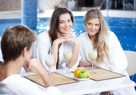 Two attractive girls and the unique guyの写真素材