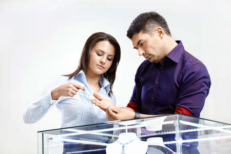 The young man chooses a gift in shopの写真素材