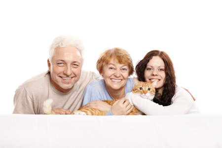 Happy family together with a cat on a white backgroundの写真素材