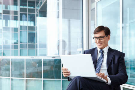 A man in a business suit in the officeの写真素材