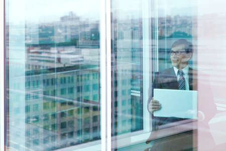 Head to the laptop in the officeの写真素材