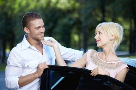 Young happy couple about carsの写真素材