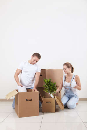 Young attractive couple unpacked