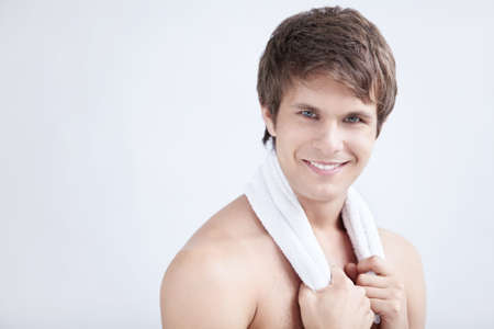 Portrait of a young man with a towelの写真素材