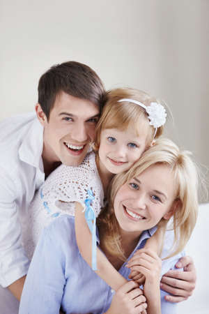 Portrait of a happy family of threeの写真素材