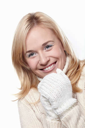 Young attractive girl in the mittens on a white backgroundの写真素材