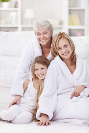 Grandmother, mother and daughter in the morning in an apartment