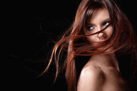 A pretty young girl with flowing hairの写真素材